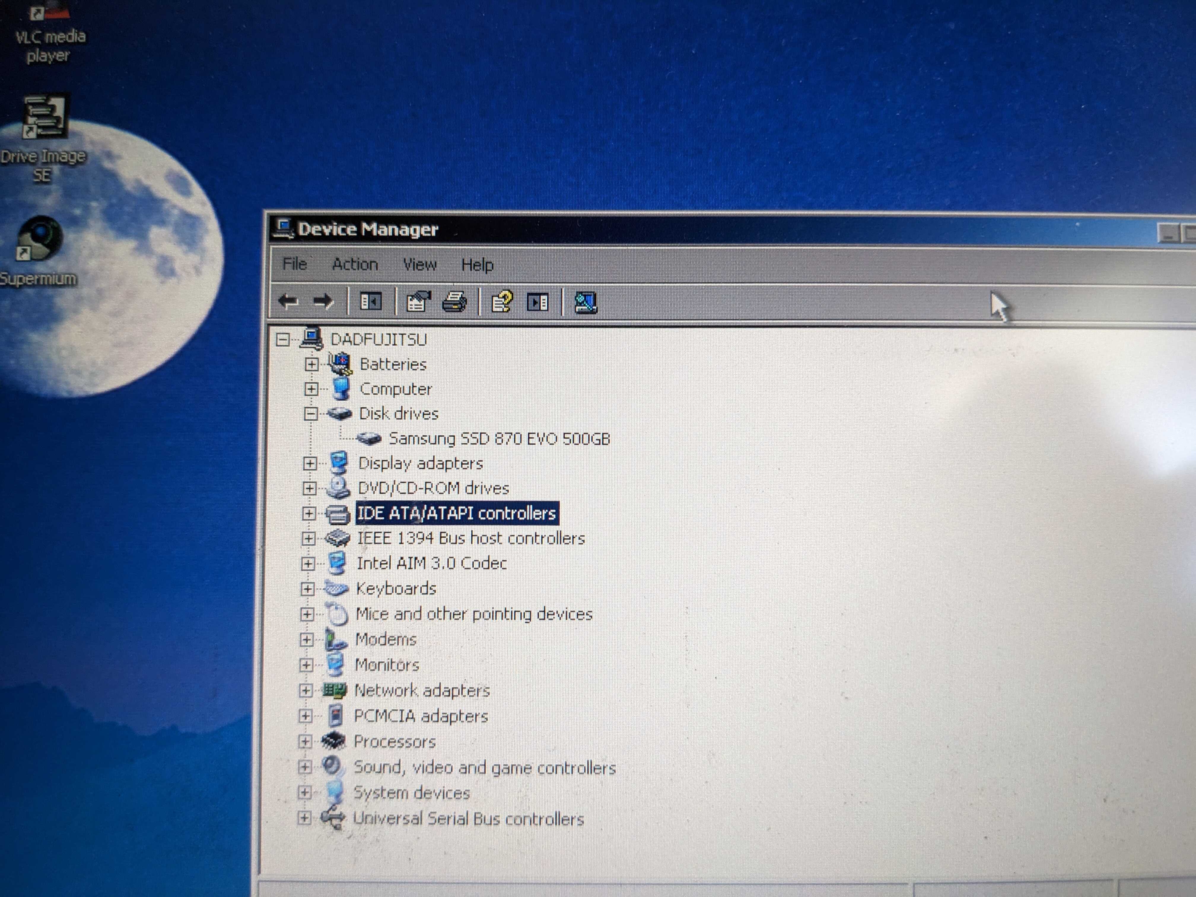 Windows XP Device Manager showing SSD's model name.